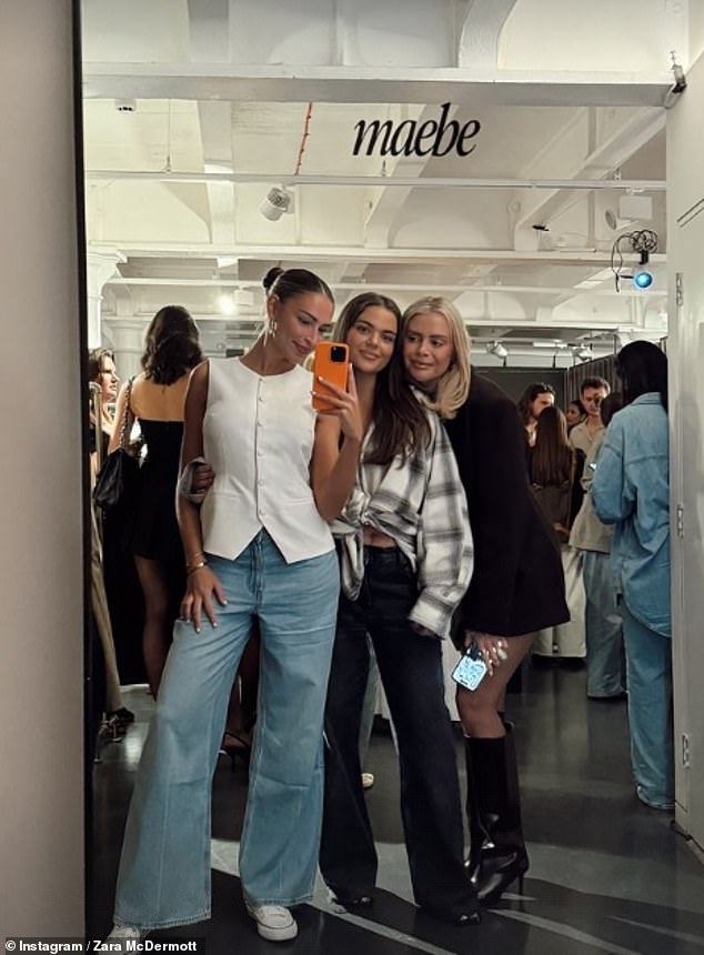 The social media personality looked as glamorous as ever in a white vest paired with blue jeans, as she posed for mirror selfies with influencers Tayla Blue and Perrie Sian.