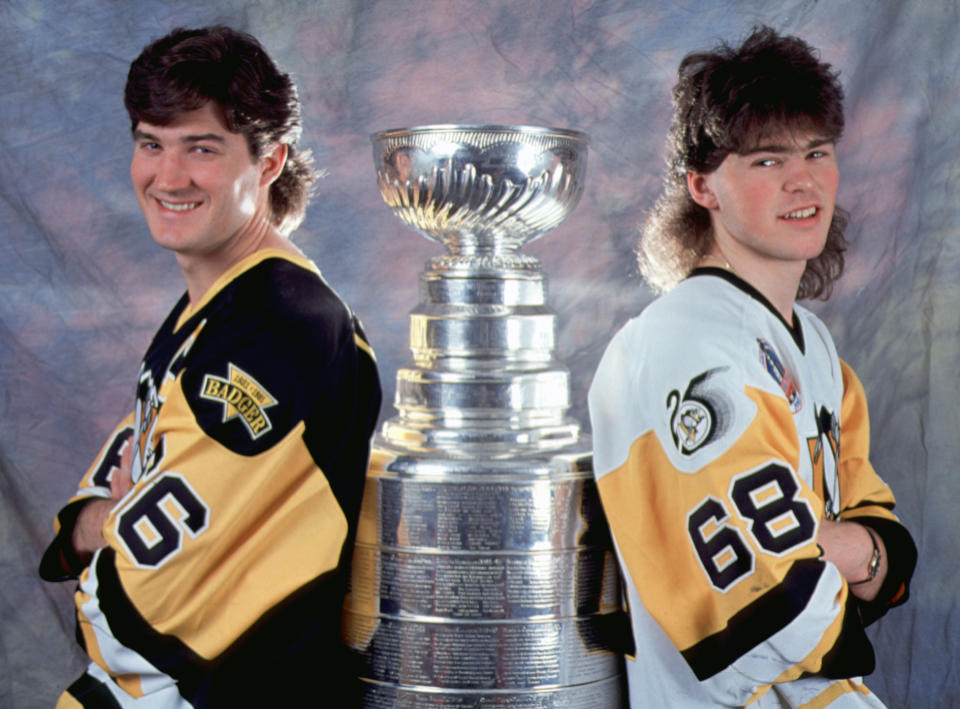 Canadian professional hockey player Mario Lemieux #66 (left) and fellow Czech player Jaromir Jagr #68 of the Pittsburgh Penguins pose with the Stanley Cup, early 1990s. The Pens won the championship trophy in 1991 and 1992. (Photo by Bruce Bennett Studios via Getty Images Studios/Getty Images) 