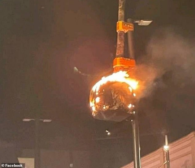 On New Year's Day 2022, the expensive installation survived an arson attack when a lit firecracker was thrown into its base and engulfed the artwork in flames (pictured).