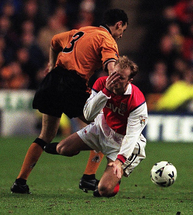 On the pitch, Muscat was a force to be reckoned with (pictured after falling out with Arsenal legend Dennis Bergkamp when he played for Wolves)