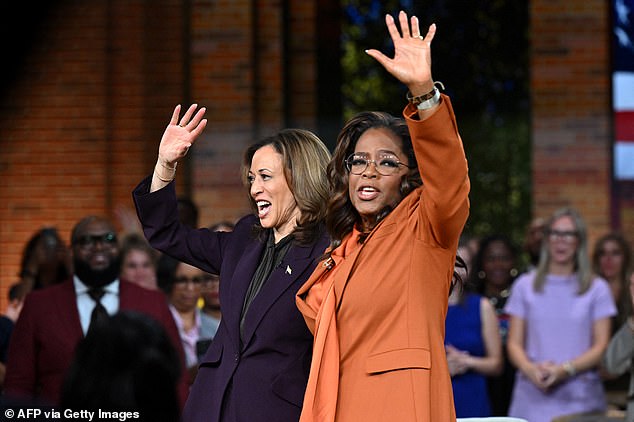 Harris and Winfrey wave to the crowd during a live-streamed Unite for America rally in Farmington Hills, Michigan