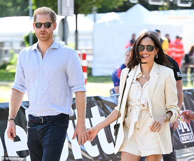 Harry and Meghan attend the cycling medal ceremony on the cycling track during day six of the Invictus Games last year.