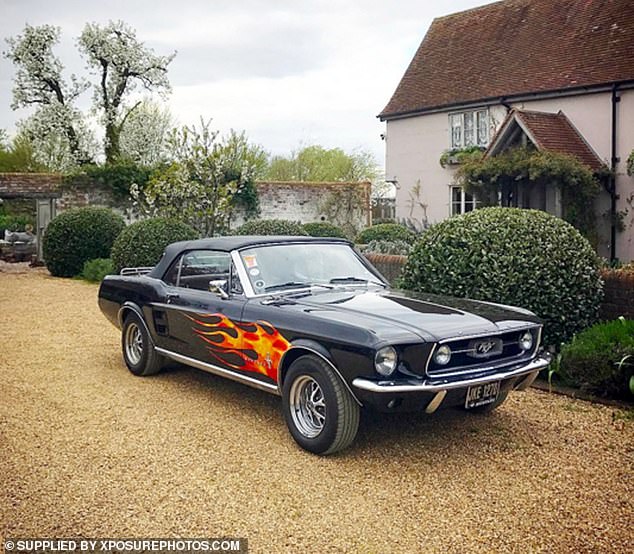 Jamie's fire-painted Ford Mustang is one of the cars in his classic motor collection.