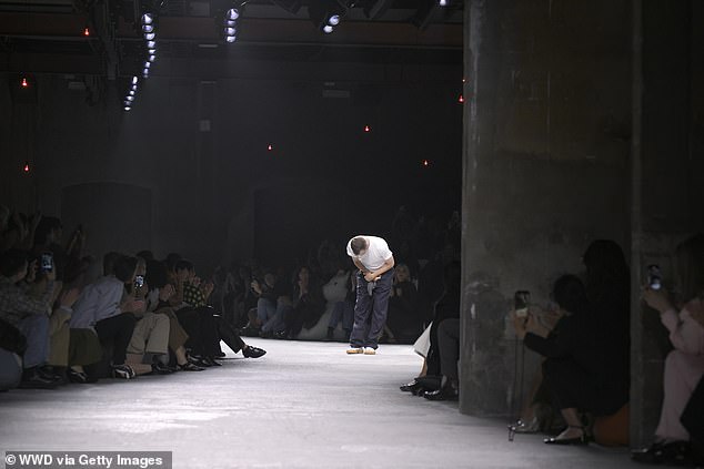 Artistic director Matthieu Blazy takes a bow on the catwalk at the Bottega Veneta show