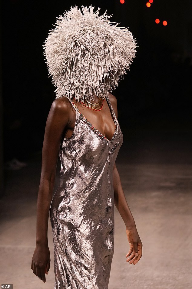 1726959556 722 Would you wear this Models wear VERY strange pointy hats