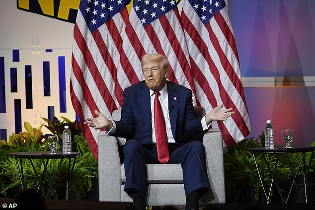 Trump is pictured at the National Association of Black Journalists event in Chicago in July, where he made the comments about Harris' race.