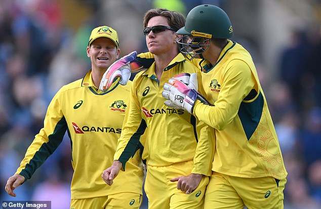 Australian player Adam Zampa is congratulated after taking the wicket of Brydon Carse