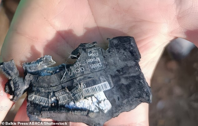 A hand shows the destroyed pager that exploded on September 17