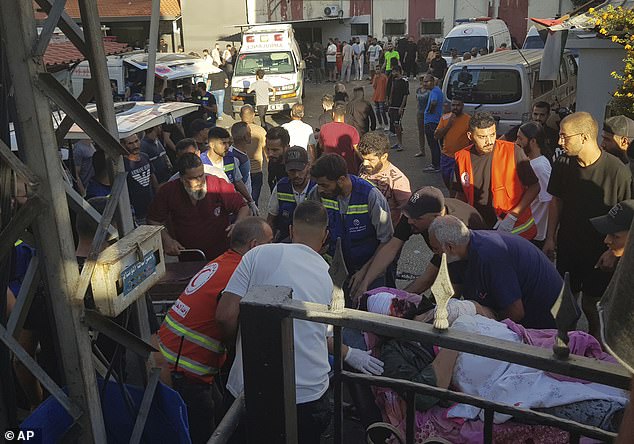 Civil Defense emergency response teams carry a man who was injured after his portable pager exploded, in the southern Lebanese port city of Sidon, Tuesday, Sept. 17, 2024.