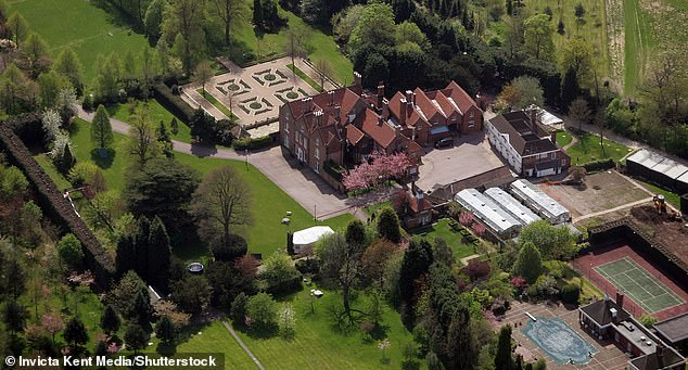 A former personal assistant to Al-Fayed has accused the disgraced businessman of groping her in front of their three children at his Surrey mansion (pictured) when she was just 19.