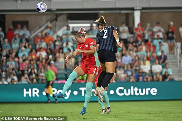 Washington Spirit forward Trinity Rodman (2) heads the ball against Kansas City