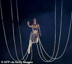 As she was lifted above the stage, Katy had a big smile on her face and raised her arms in the air.