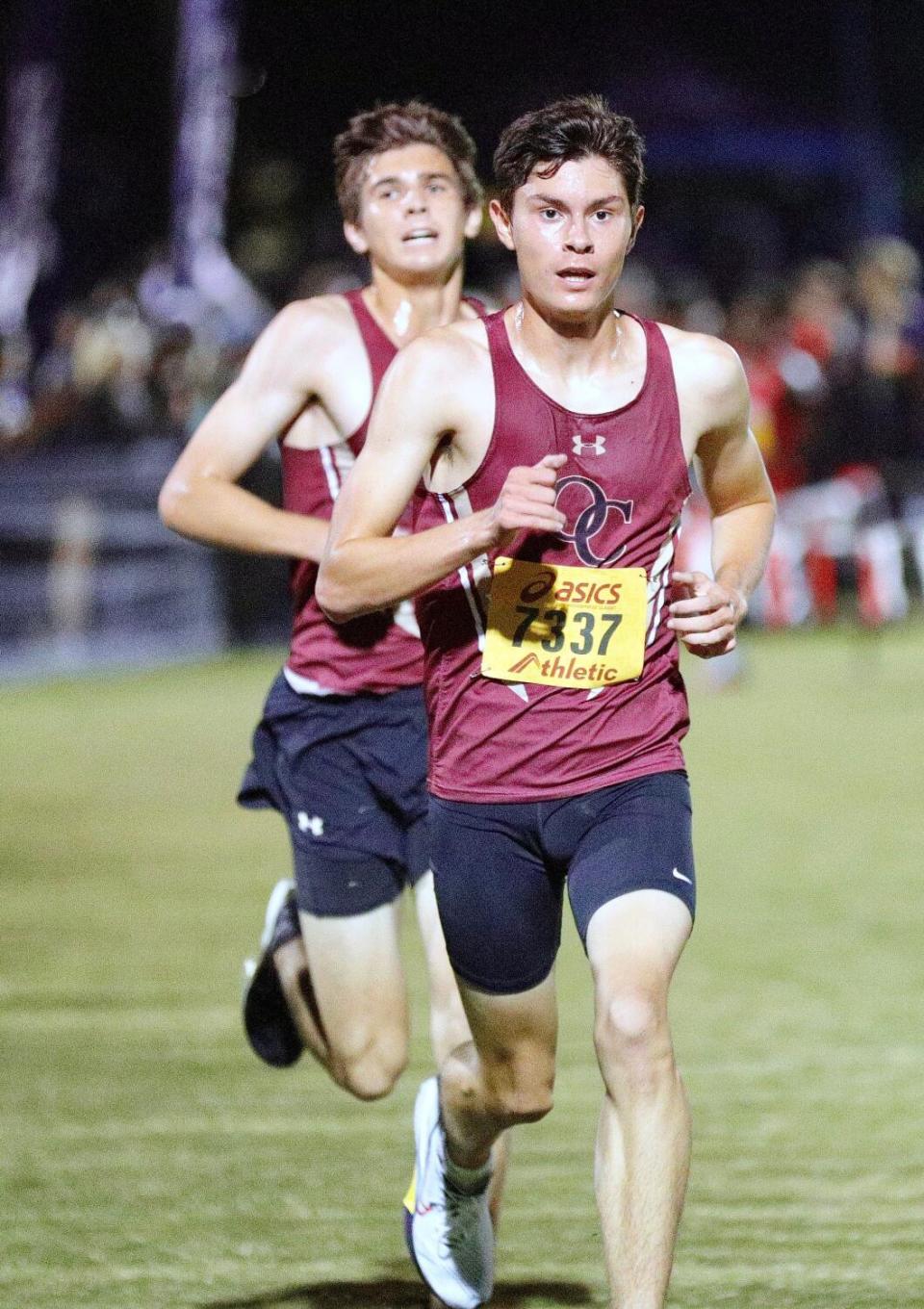 Oaks Christian teammates Christian Yoder (front) and Cooper McNee run in the Woodbridge Cross Country Classic.