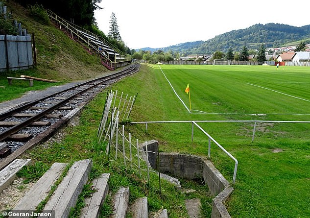 From time to time, the view from the stands is obstructed by the passing of a steam train.