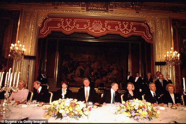 Harriman, far right, is pictured at a diplomatic dinner at the Élysée Palace in Paris honoring his protégé, President Bill Clinton, center.