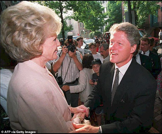 Democratic presidential candidate Bill Clinton greets Pamela Harriman on the steps of his Georgetown home in August 1992 after a fundraiser.