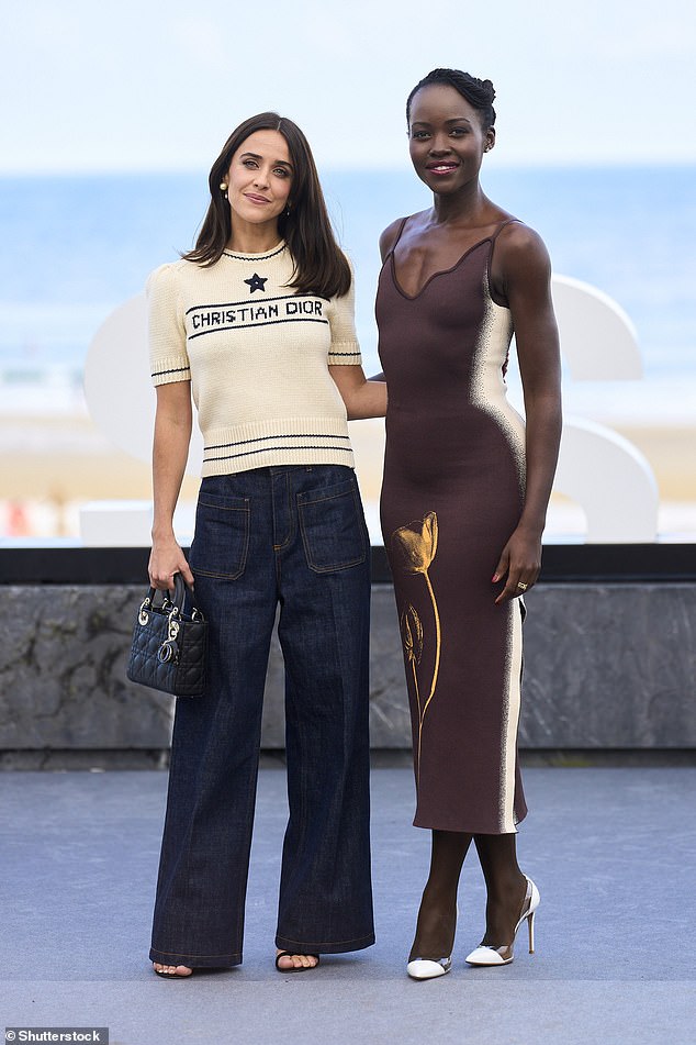 She posed alongside Spanish actress Macarena Garcia, who made a fashion statement in a cream knit Dior short-sleeved top and wide-leg jeans.