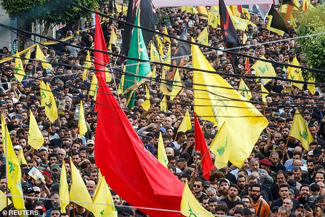 Mourners gather during the funeral of Hezbollah leader Ibrahim Aqil, who was killed in Friday's Israeli attack in the southern suburbs of Beirut.