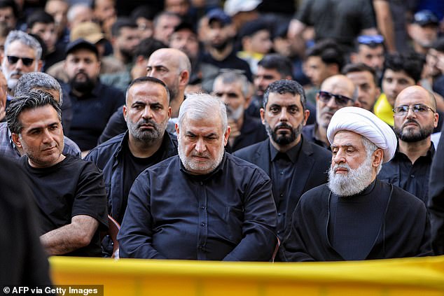 Naim Qassem (right), deputy secretary general of Hezbollah, and Mohammed Raad (center), head of Hezbollah's bloc in the Lebanese parliament, attend Aqil's funeral