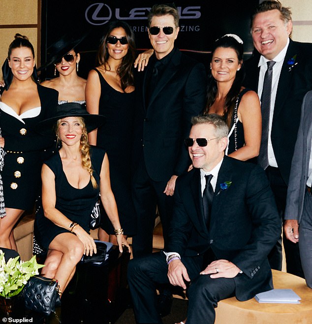 Phillips rubs shoulders with racing A-listers including Pia and Patrick Whitesell (centre)