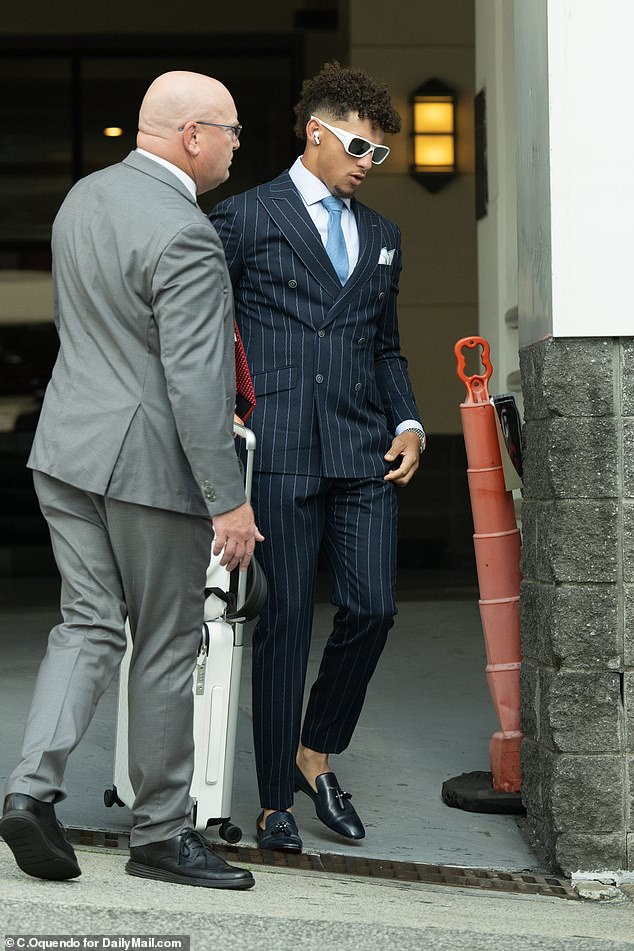 Patrick Mahomes also looked sharp, as he wore a navy blue pinstripe suit and a baby blue tie.