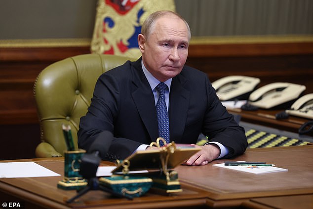 Russian President Vladimir Putin chairs a meeting with members of the Security Council on September 20