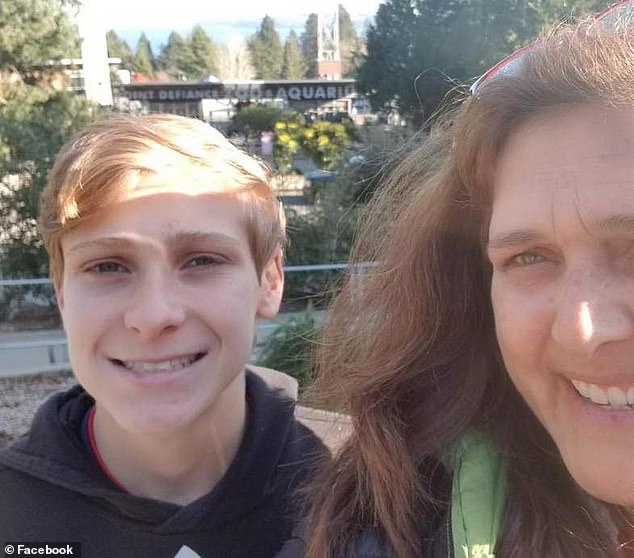 The teenager (pictured with his mother) died on the way to hospital after alerting a relative.