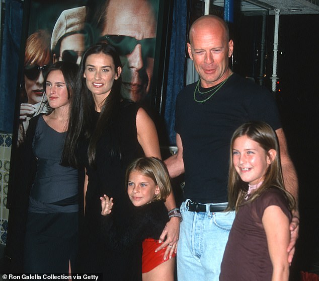 The actress, now 61 and living in Malibu with then-husband Bruce Willis, committed to biking 30 miles round trip to the set of Indecent Proposal every day, trying her best to regain her pre-pregnancy figure; (pictured in 2001: Demi (second from left), Bruce (second from right) and their children, from left, Rumer Willis, Tallulah Belle Willis and Scout Willis)