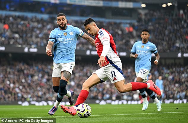 Walker (left) was caught out of position as he attempted to return from an Arsenal free-kick.