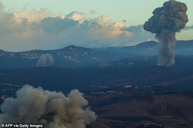 Plumes of smoke rise from the site of an Israeli airstrike in Aramti, near the Lebanese-Israeli border, on September 23, 2024.