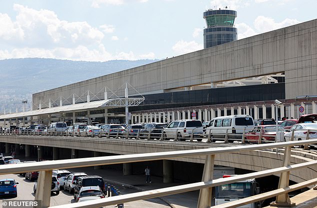 A line of cars is seen outside Beirut's Rafic Hariri International Airport this morning as people are told to evacuate.