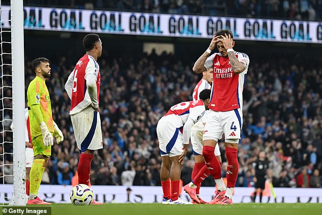 Arsenal defenders were left dejected after failing to secure victory against their title rivals.