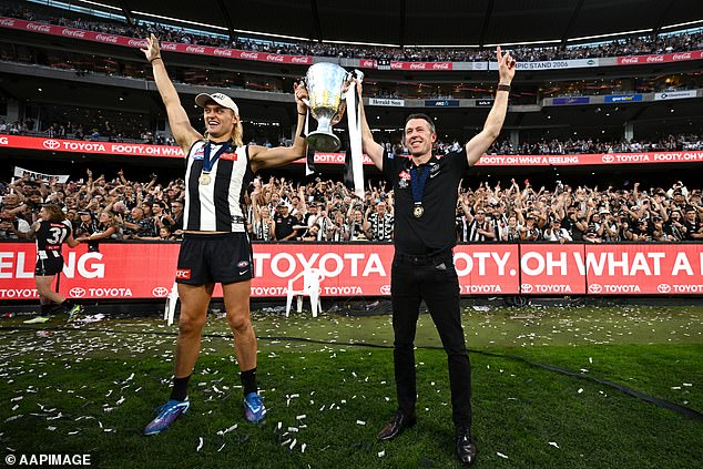 His dedication and hard work paid off when he was appointed as Collingwood's head coach in 2021. (Pictured with Darcy Moore when Collingwood won the 2023 AFL Grand Final)