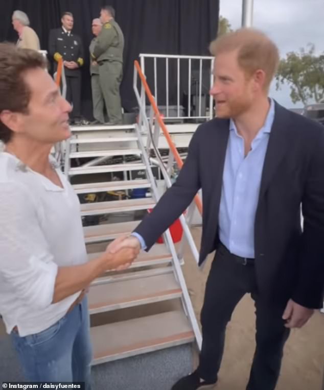 Pictured: Prince Harry shaking hands with Richard Marx, who performed at Kevin Costner's One805Live! concert yesterday