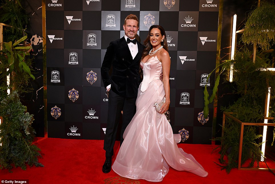 Brodie Ryan, the partner of AFL legend Nathan Buckley, also failed on this year's red carpet, sporting a baby pink corset dress with a plunging neckline, pearls and a bird-shaped handbag.