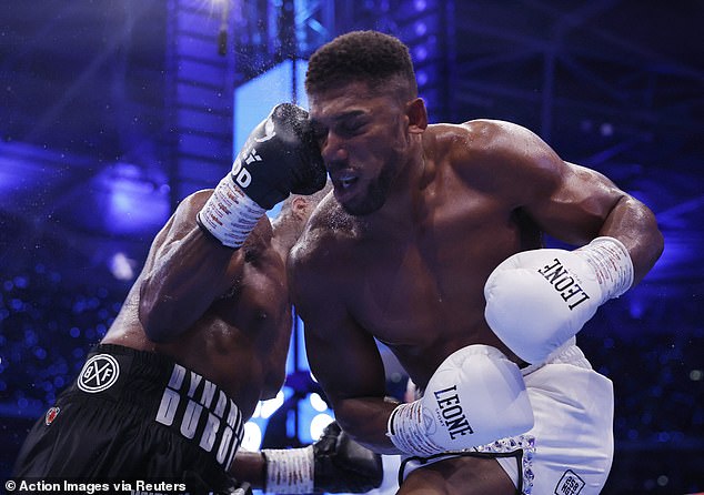 Dubois (left) came out landing punches on Joshua, who took a beating in the first five rounds.