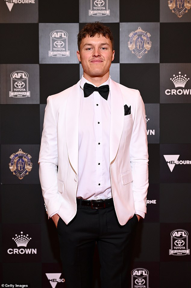 Jack, 21, kept his look sleek and sophisticated in a crisp white blazer paired with black trousers and a classic black bow tie.