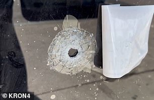 Bullet holes riddled the storefronts along E 18th Street on Sunday morning.