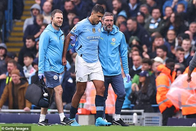 Rodri (centre) limped off the pitch during City's 2-2 draw with Arsenal on Sunday afternoon