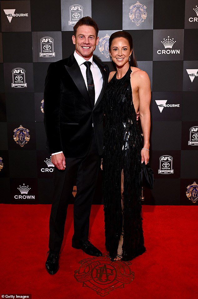 The former West Coast Eagles superstar, 46, was pictured looking a picture of health and happiness as he proudly posed with his date of the night, sister Melanie (left).