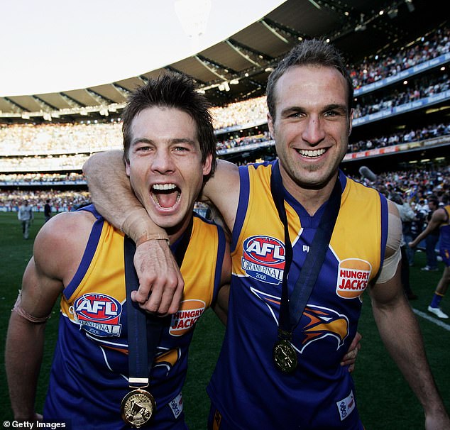 Pictured: Ben celebrates with teammate Chris Judd after the West Coast Eagles won an AFL Grand Final in 2006.