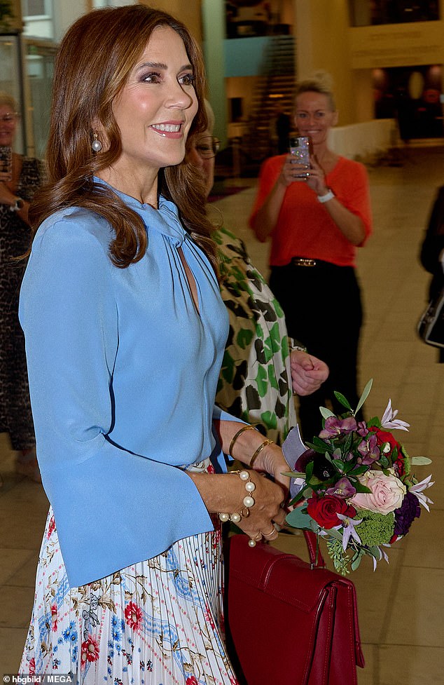 The 52-year-old royal was pictured beaming as she attended today's event in Copenhagen.