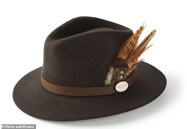 The Hicks and Brown 'Suffolk' hat, which costs £109 and is available in six shades, is trimmed with orange feathers, which are secured in a brown leather band.