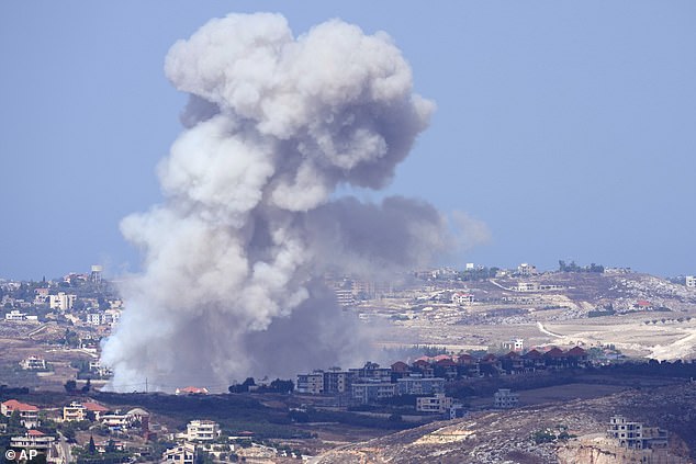 Smoke rises following Israeli airstrikes on villages in the Nabatiyeh district on Monday, September 23.