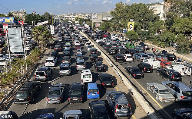 Lebanese flee in their cars from southern Lebanon towards Sidon and Beirut, on the Zahrani-Nabatieh highway, in Ghazieh, southern Lebanon, on September 23.