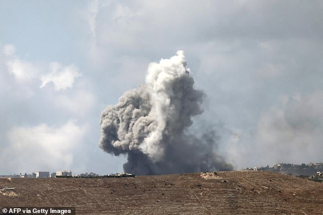 Columns of smoke rise after an Israeli attack near the border on Monday