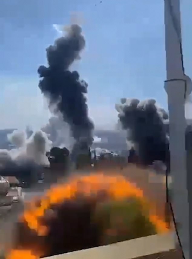 Terrifying images show a huge explosion as people scream in the background.