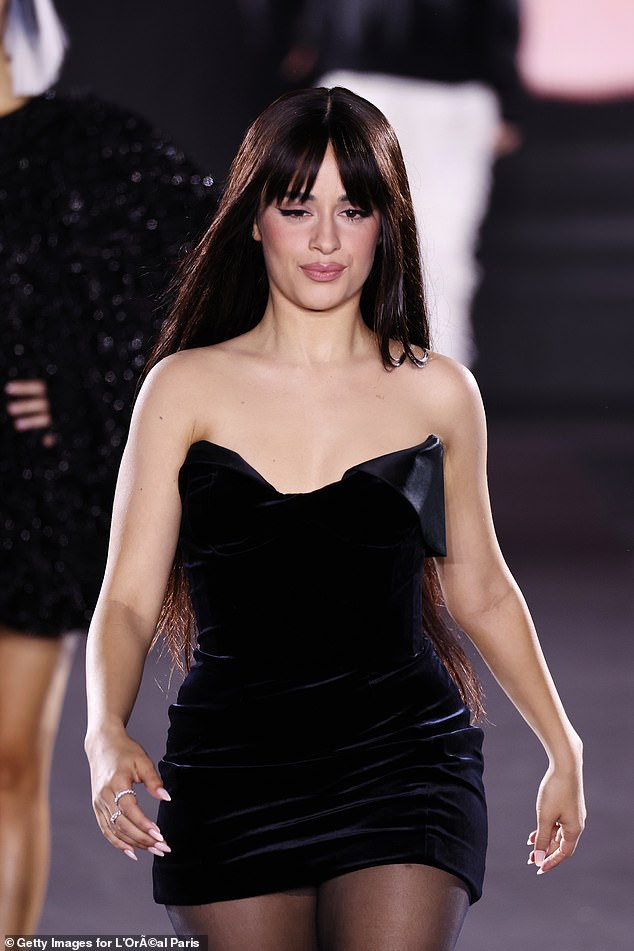 The 27-year-old singer donned a strapless black velvet mini dress as she looked confident at the iconic event.