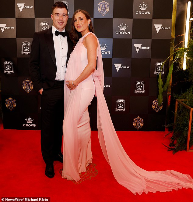 Zach Merrett's wife Alexandra (pictured) was also the picture of elegance as she proudly showed off her baby bump after confirming the news of her baby.