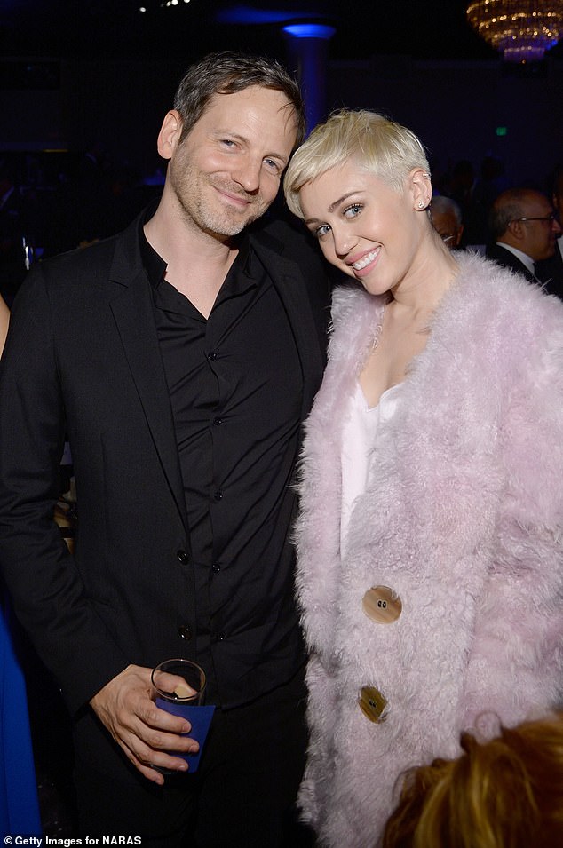 Dr. Luke, who has strongly denied Kesha's allegations, is responsible for producing some of the biggest hits of the past few decades and continues to have chart-topping hits, although he now uses a pseudonym to avoid controversy; seen with Miley Cyrus in 2014